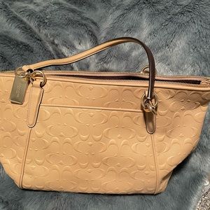 Tan Coach purse